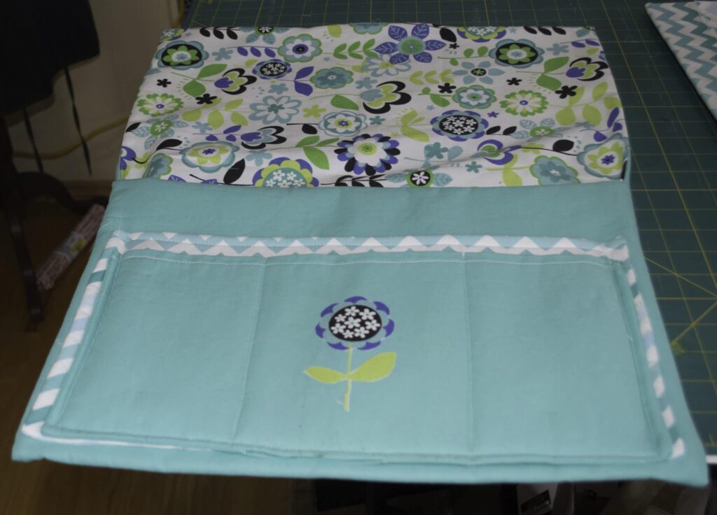 Add an applique to one of the pockets Pretty little bedside caddy