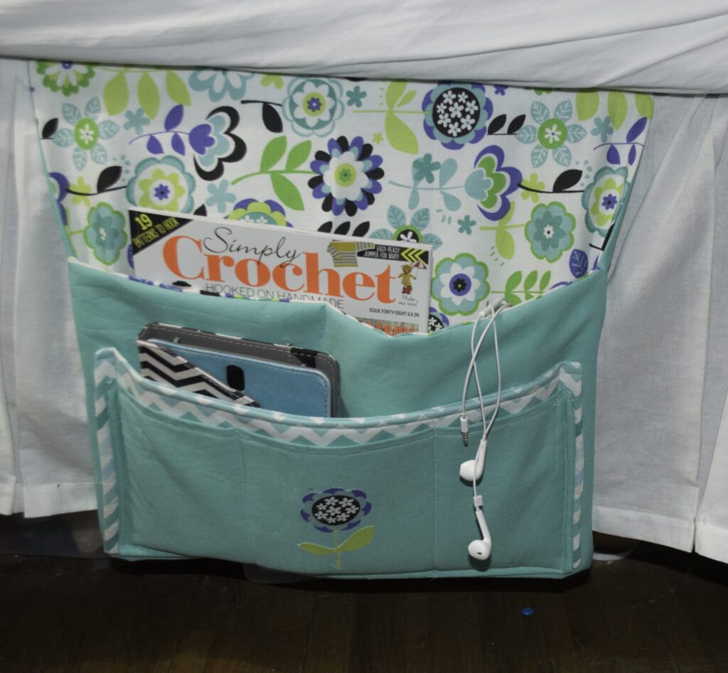 Place the Caddy under the Mattress with the Pockets Hanging Down Pretty little bedside caddy