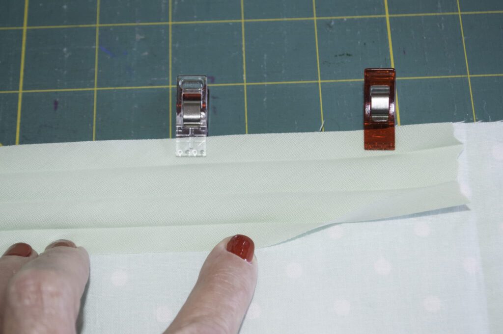 Place the Wide SIde onto the Raw Edges of the Back of your Project How to sew bias binding