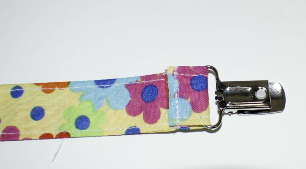 Insert One End into the Mitten Shank DIY Pacifier Clips