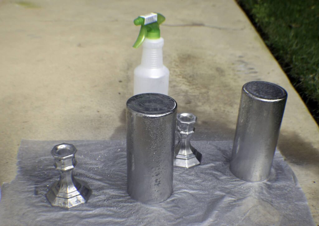 Spray the Glass with Vinegar and Water then the Paint Dollar Store Faux Mercury Glass Hurricanes